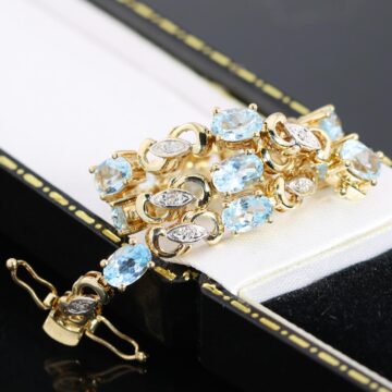 Złota bransoletka z topazami i diamentami 18,3cm 9K